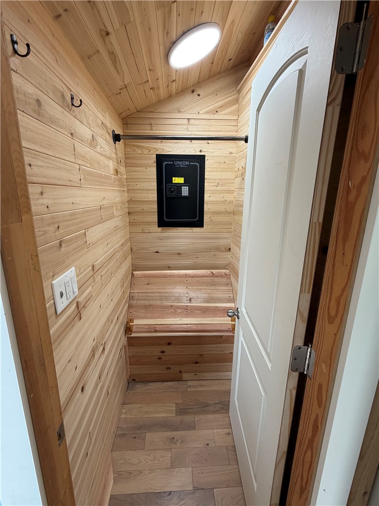 707 South Spring Street Walhalla, SC 29691 - Photo 14 of 20 This cozy wooden closet offers practical storage solutions with a warm, inviting ambiance.