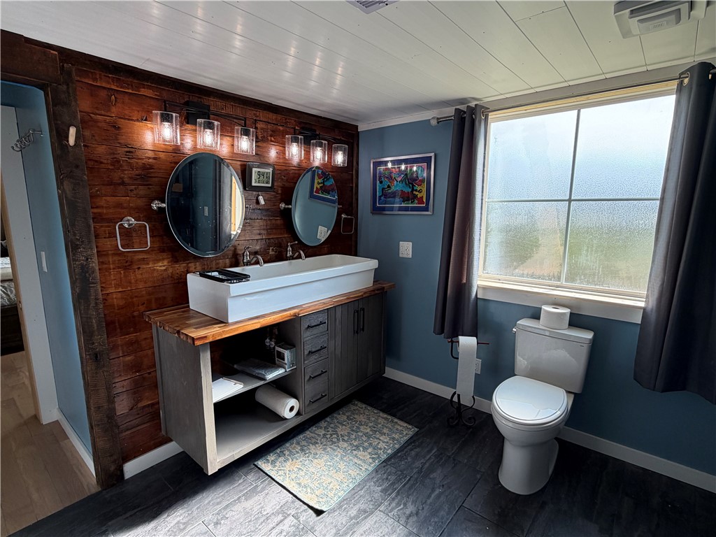707 South Spring Street Walhalla, SC 29691 - Photo 15 of 20 This bathroom features unique wooden accents and durable tile flooring.