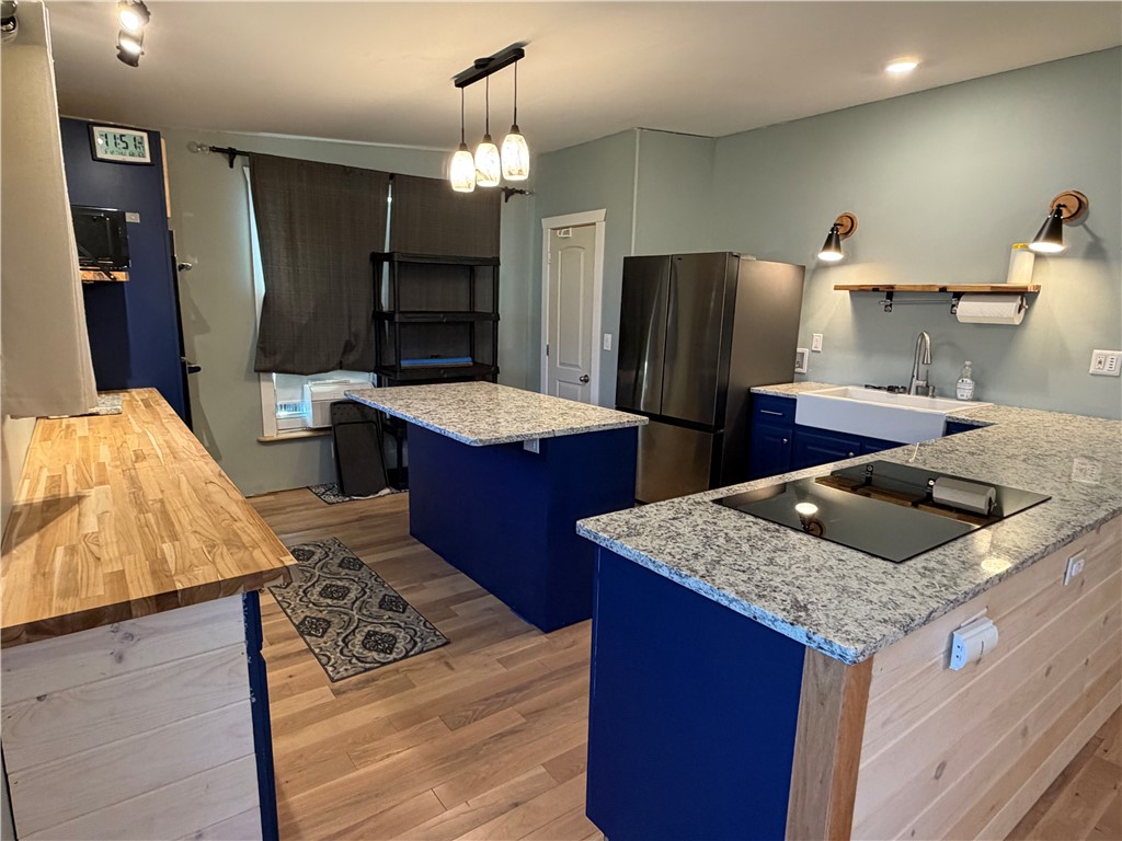 707 South Spring Street Walhalla, SC 29691 - Photo 7 of 20 This modern kitchen features a spacious layout, perfect for culinary endeavors and casual dining.
