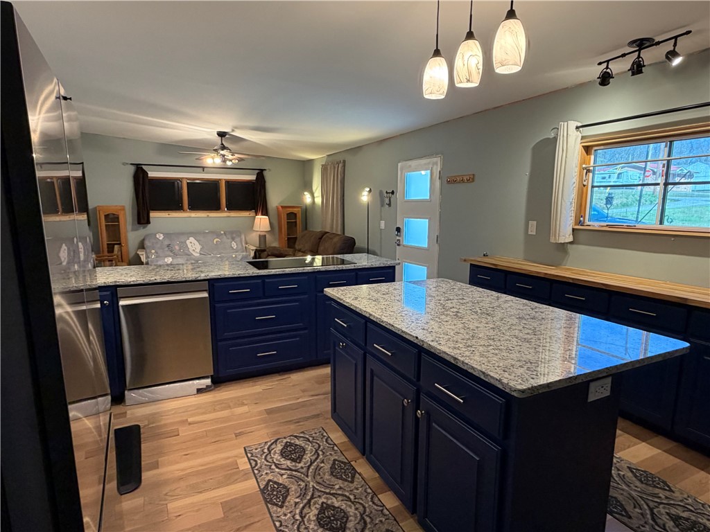 707 South Spring Street Walhalla, SC 29691 - Photo 8 of 20 This open concept kitchen offers functional design with ample counter space and natural light.