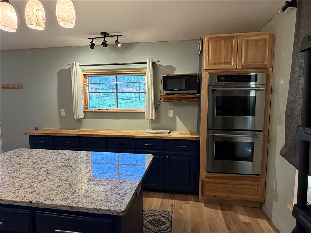 707 South Spring Street Walhalla, SC 29691 - Photo 9 of 20 This modern kitchen features a spacious island and state-of-the-art appliances.