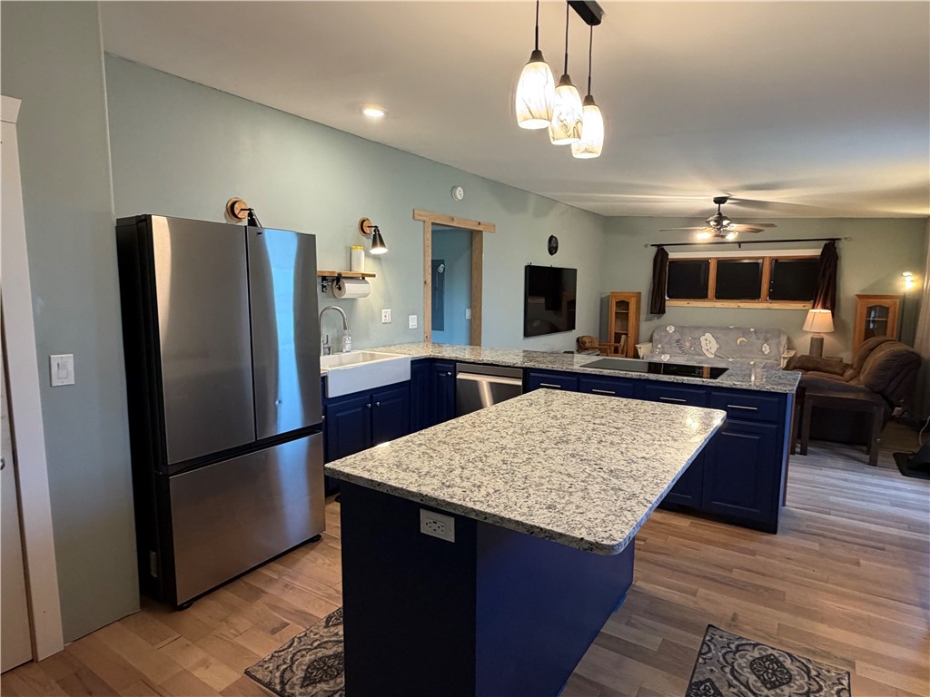 707 South Spring Street Walhalla, SC 29691 - Photo 10 of 20 This kitchen blends seamless functionality with stylish design, offering a comfortable and inviting atmosphere.