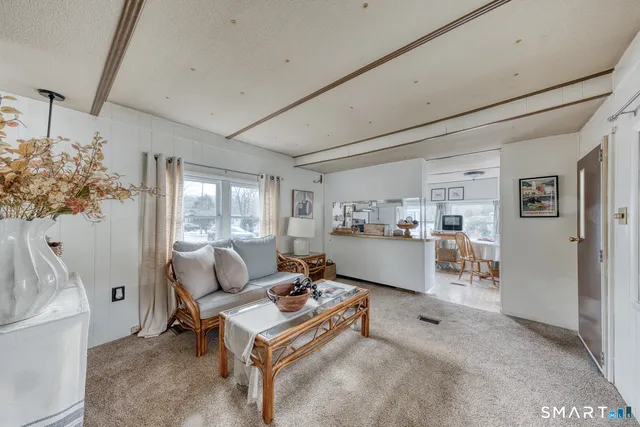 a living room with furniture and a table