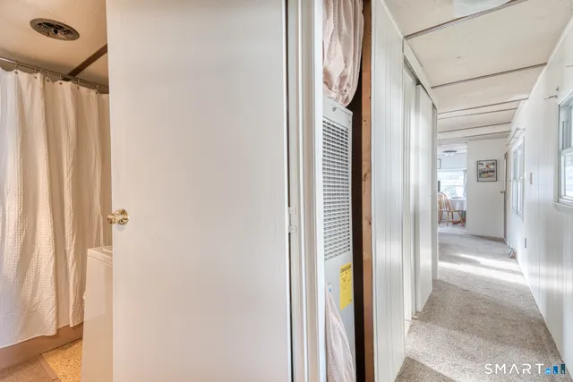 a view of a bathroom from a hallway