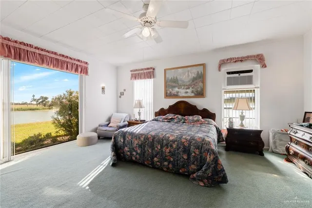 a bedroom with furniture and a mirror