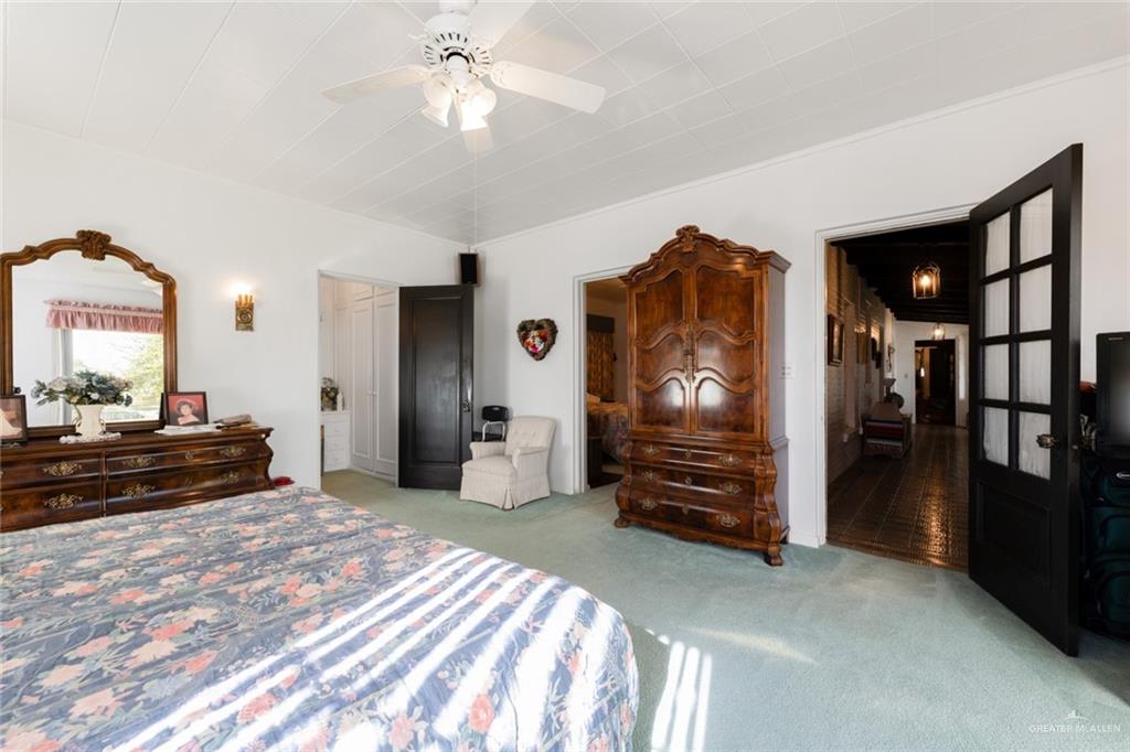 1420 West Estero Drive Progreso Lakes, TX 78596 - Photo 24 of 42 a bedroom with furniture and a mirror