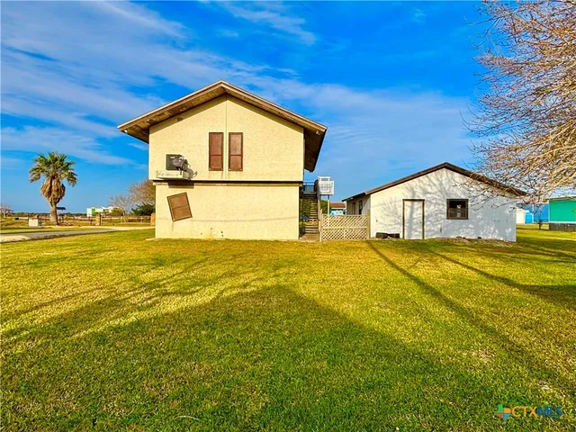 a view of a backyard of house