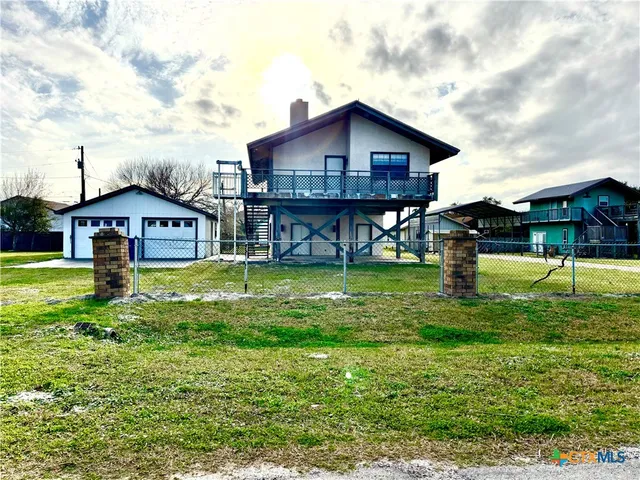 a view of a house with a big yard