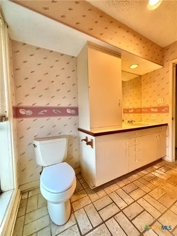 a view of balcony with furniture