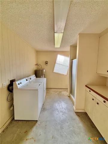 a spacious bathroom with a granite countertop sink toilet and shower