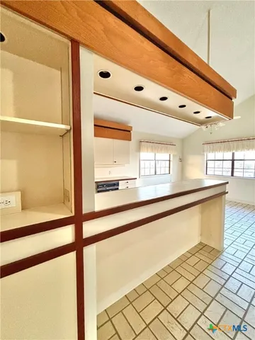 a view of a living room with a large window