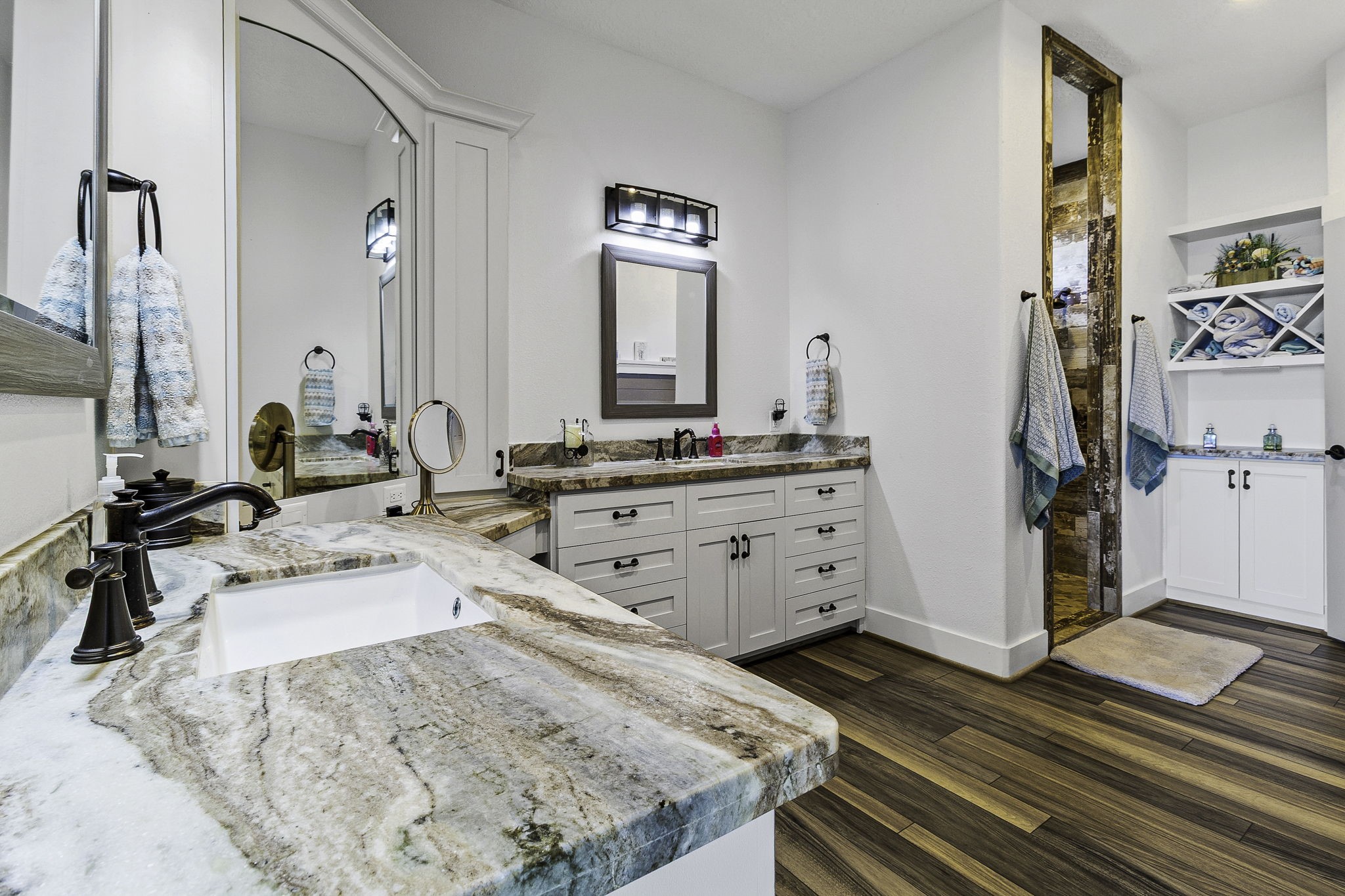 151 Key Largo Loop Point Blank, TX 77364 - Photo 18 of 49 Spa-inspired primary bath features dual vanities, stunning marble countertops, custom cabinetry, and designer finishes throughtout.