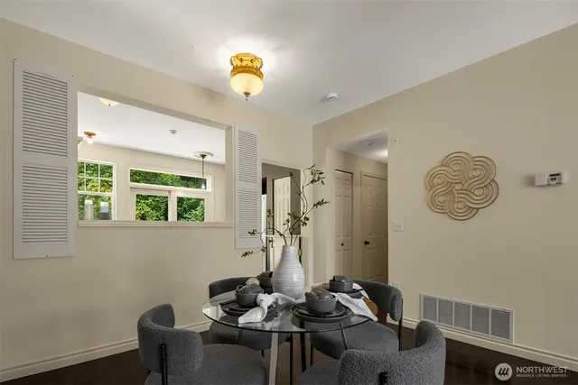 a dining room with furniture and window