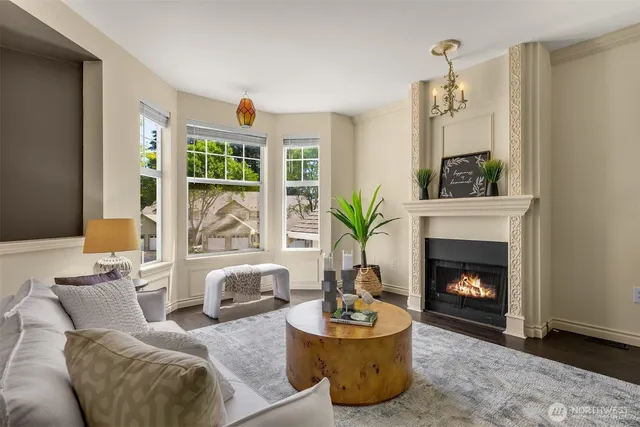 a living room with furniture fireplace and window