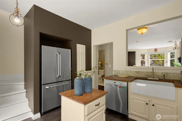 a kitchen with a sink and refrigerator