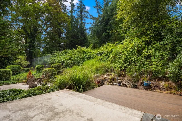 a view of a house with a yard and sitting space
