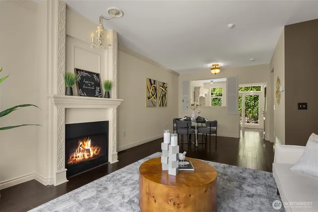 a living room with furniture a fireplace and a table