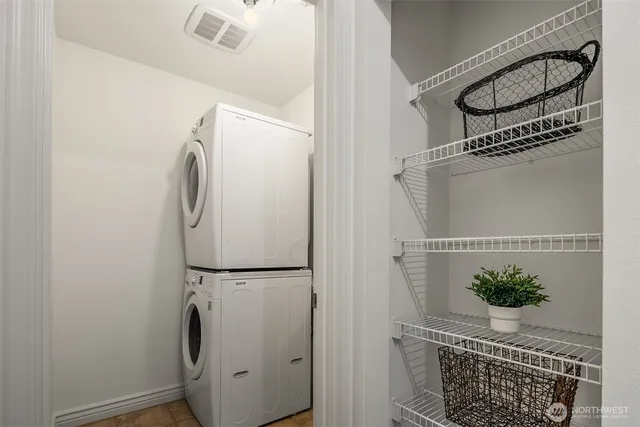 a close view of a utility room with washer and dryer