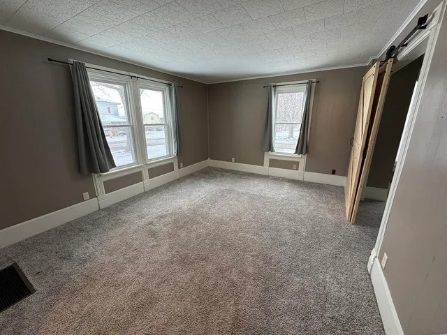 an empty room with windows