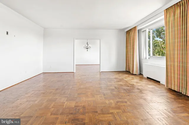 a view of an empty room with a window