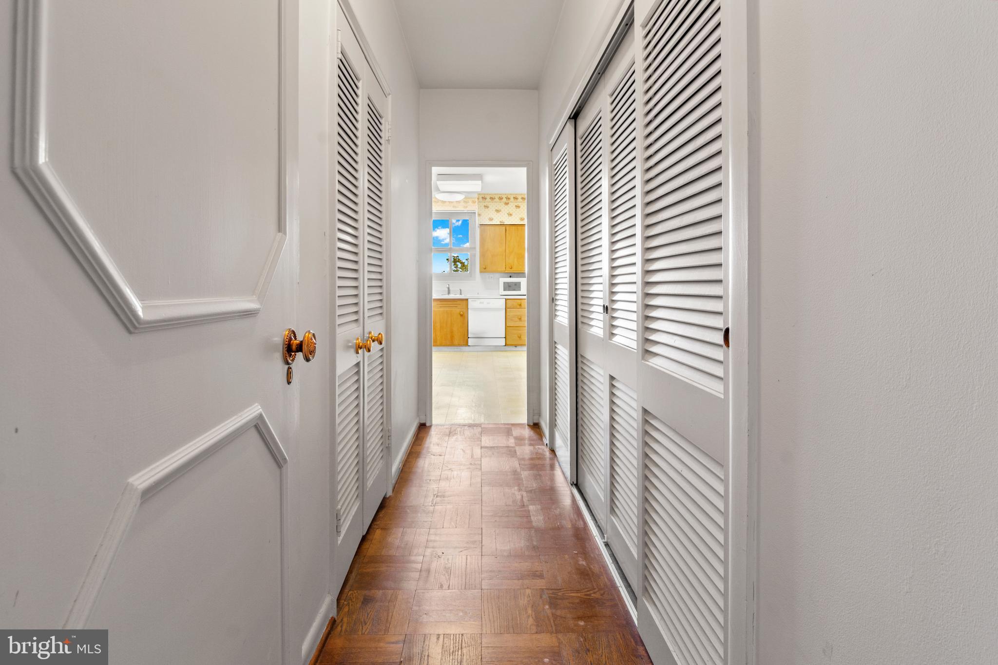 11 Slade Avenue, Unit 712 Baltimore, MD 21208 - Photo 19 of 30 a view of a hallway with wooden floor and staircase