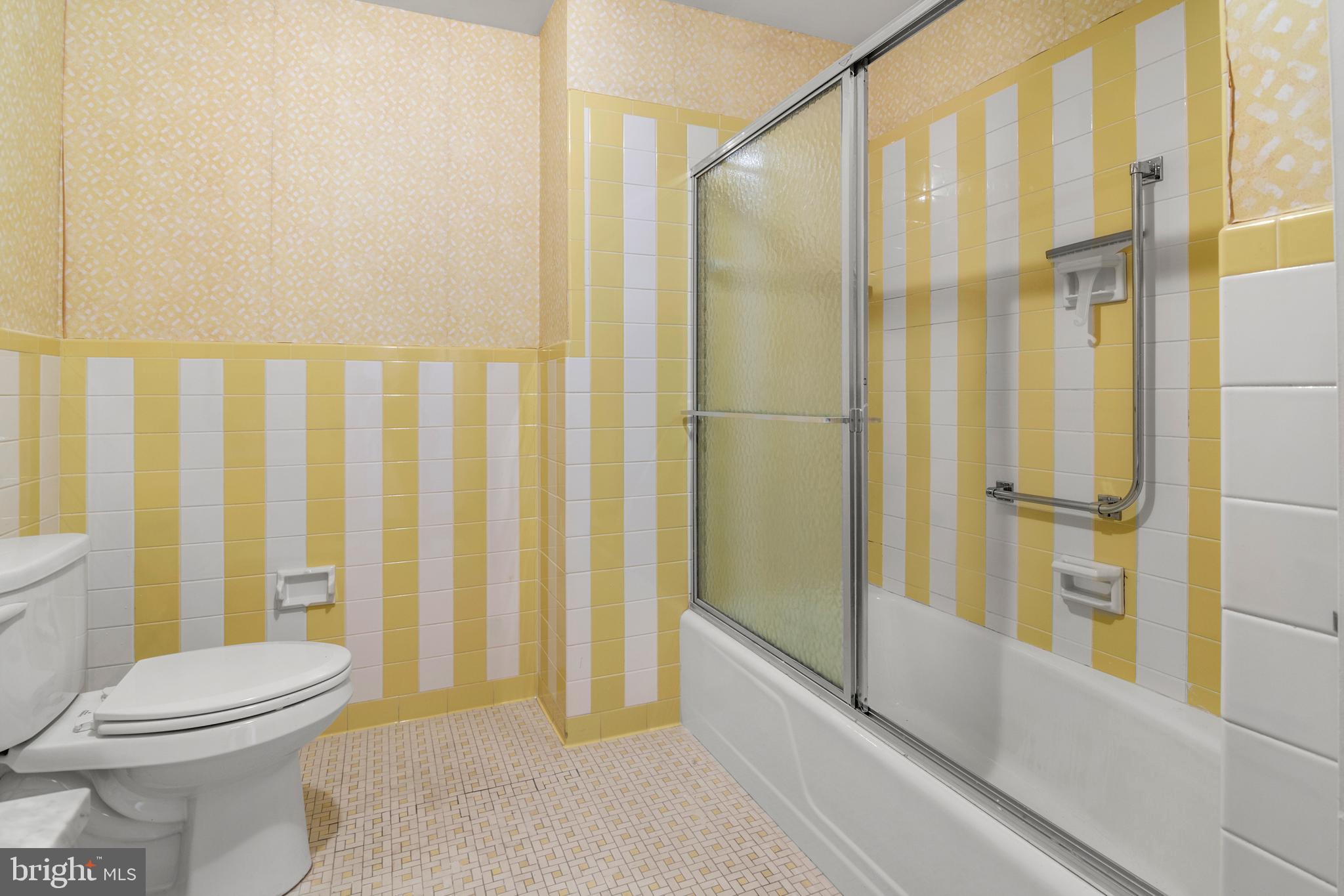 11 Slade Avenue, Unit 712 Baltimore, MD 21208 - Photo 25 of 30 a bathroom with a toilet and shower