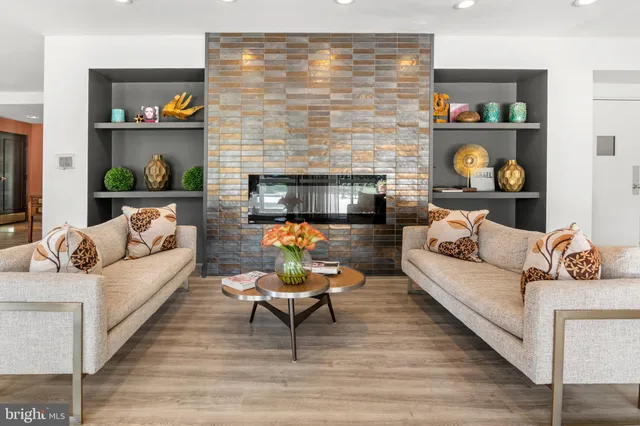 a living room with furniture and a fireplace