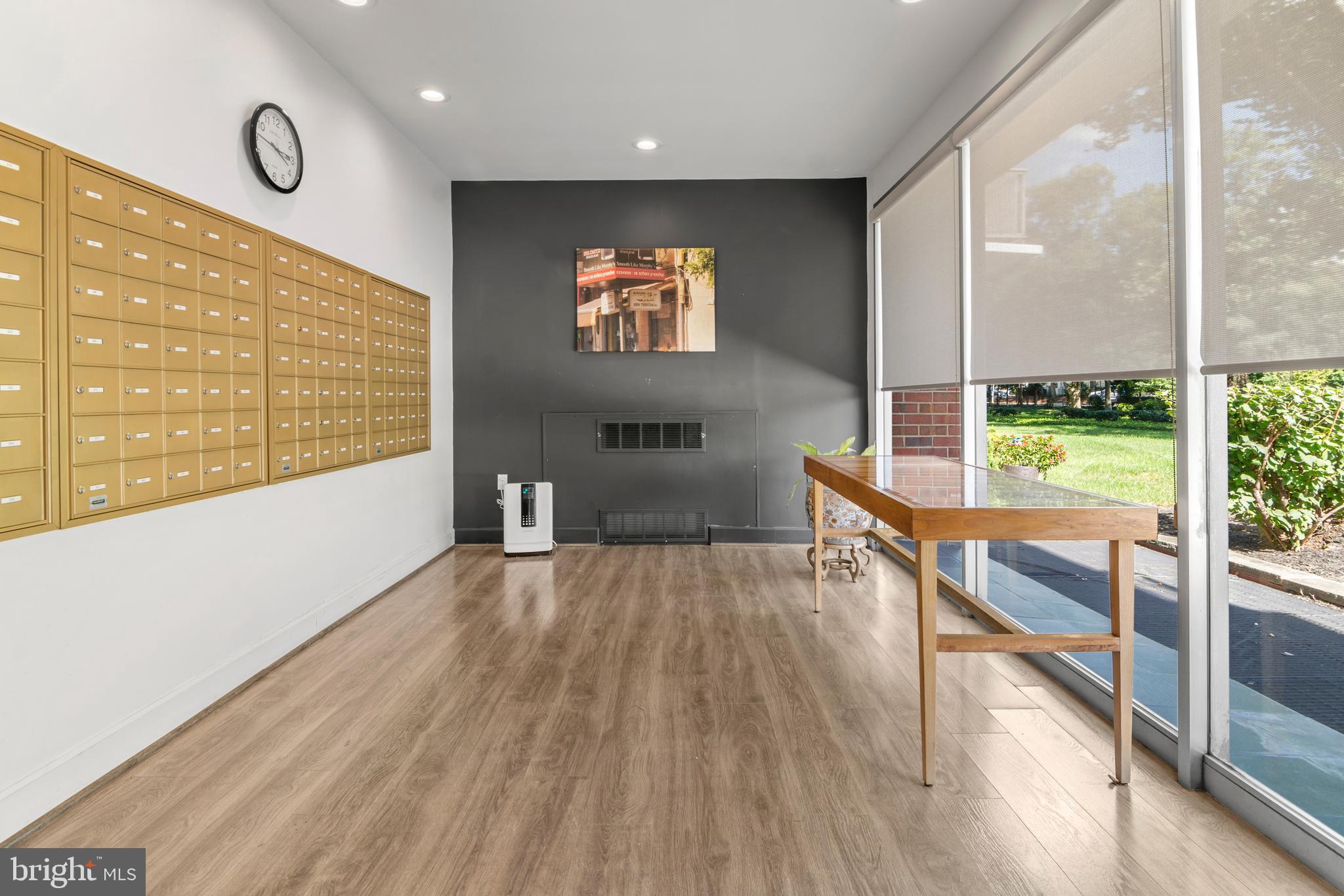 11 Slade Avenue, Unit 712 Baltimore, MD 21208 - Photo 7 of 30 a view of an empty room with wooden floor and a window