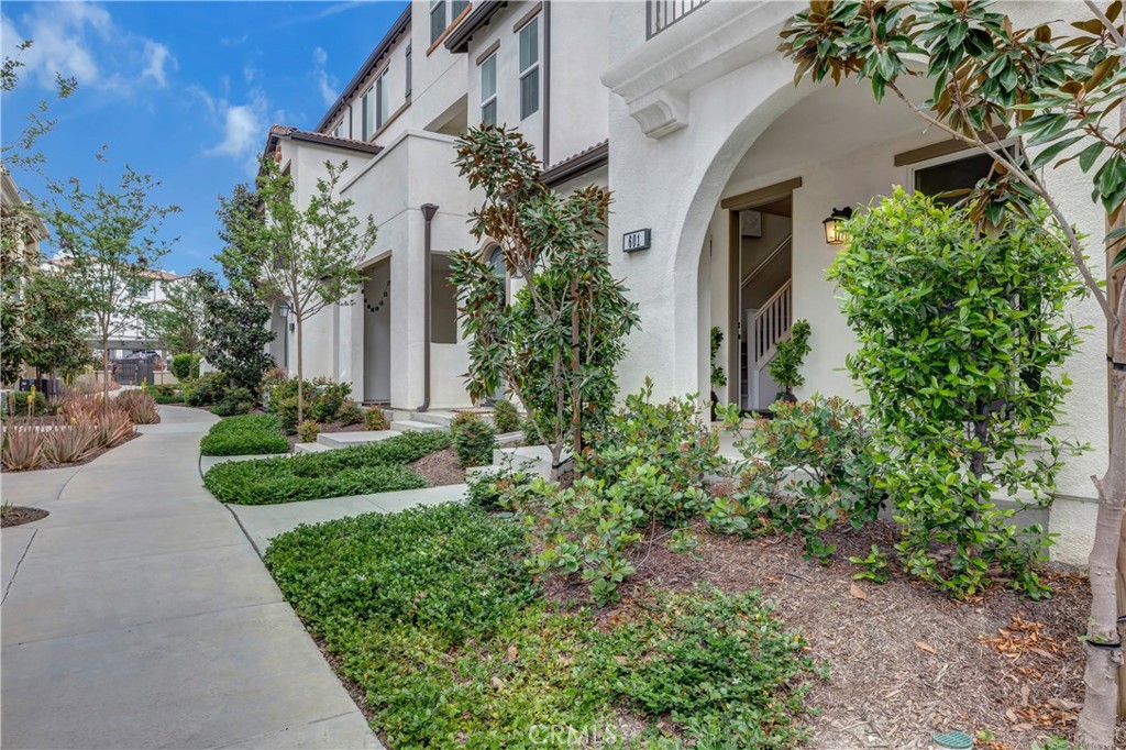 601 Shadowbrook Lake Forest, CA 92610 - Photo 1 of 1 a front view of a house with garden