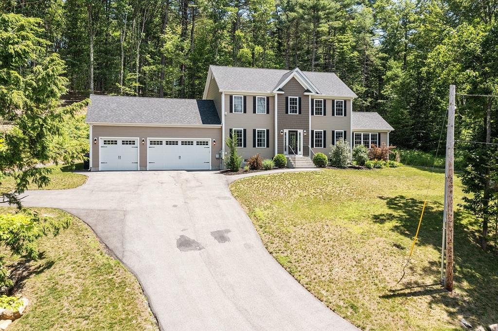 100 Platts Road Ashburnham, MA 01430 - Photo 1 of 42 front view of a house with a yard