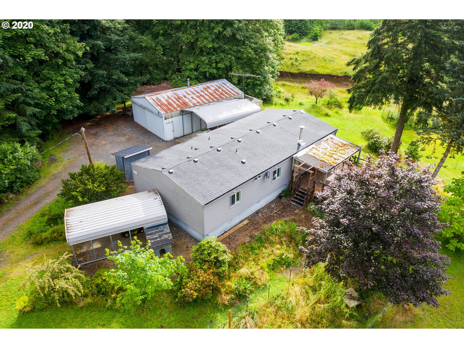 70435 Forest Park Road Rainier, OR 97048 - Photo 5 of 29 a view of a terrace with a garden