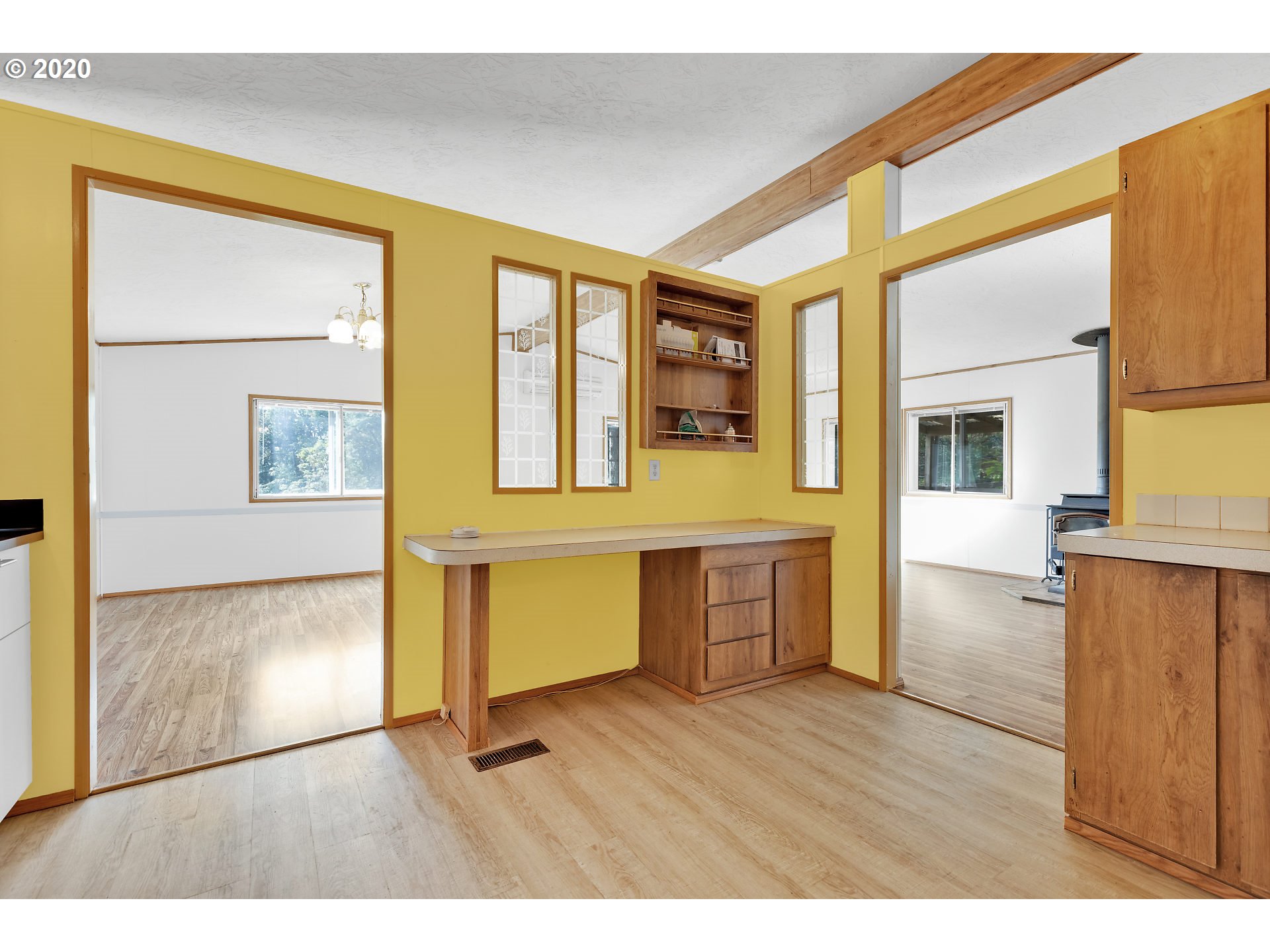 70435 Forest Park Road Rainier, OR 97048 - Photo 8 of 29 a room with wooden floor and windows