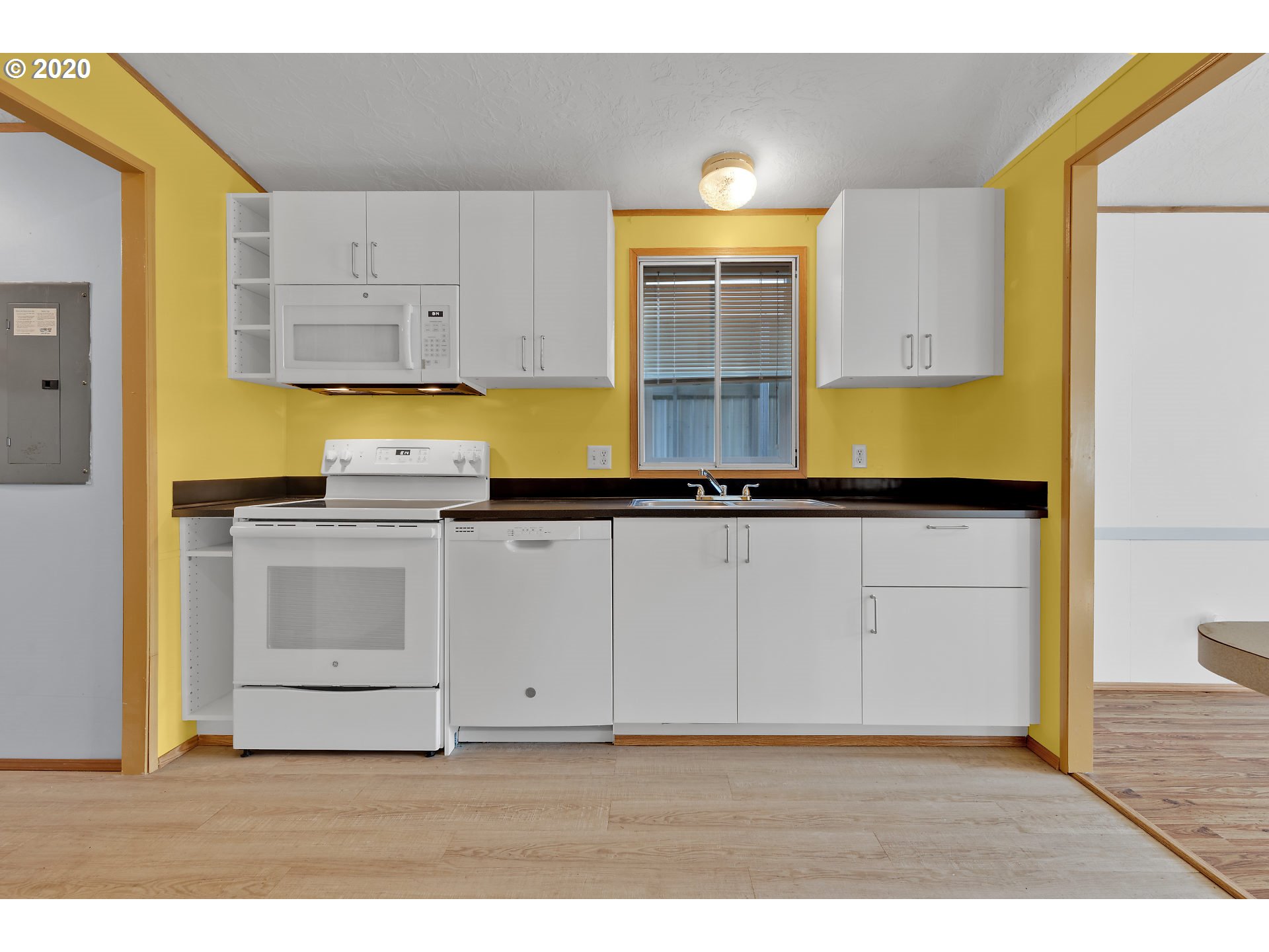 70435 Forest Park Road Rainier, OR 97048 - Photo 10 of 29 a kitchen with granite countertop a stove a sink and a granite counter tops