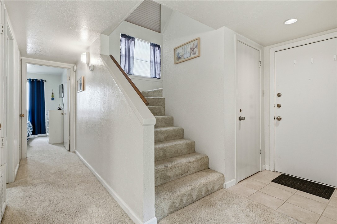 2003 North Fulton Beach Road, Unit 34 34 Rockport, TX 78382 - Photo 11 of 38 a view of entryway with furniture and stairs
