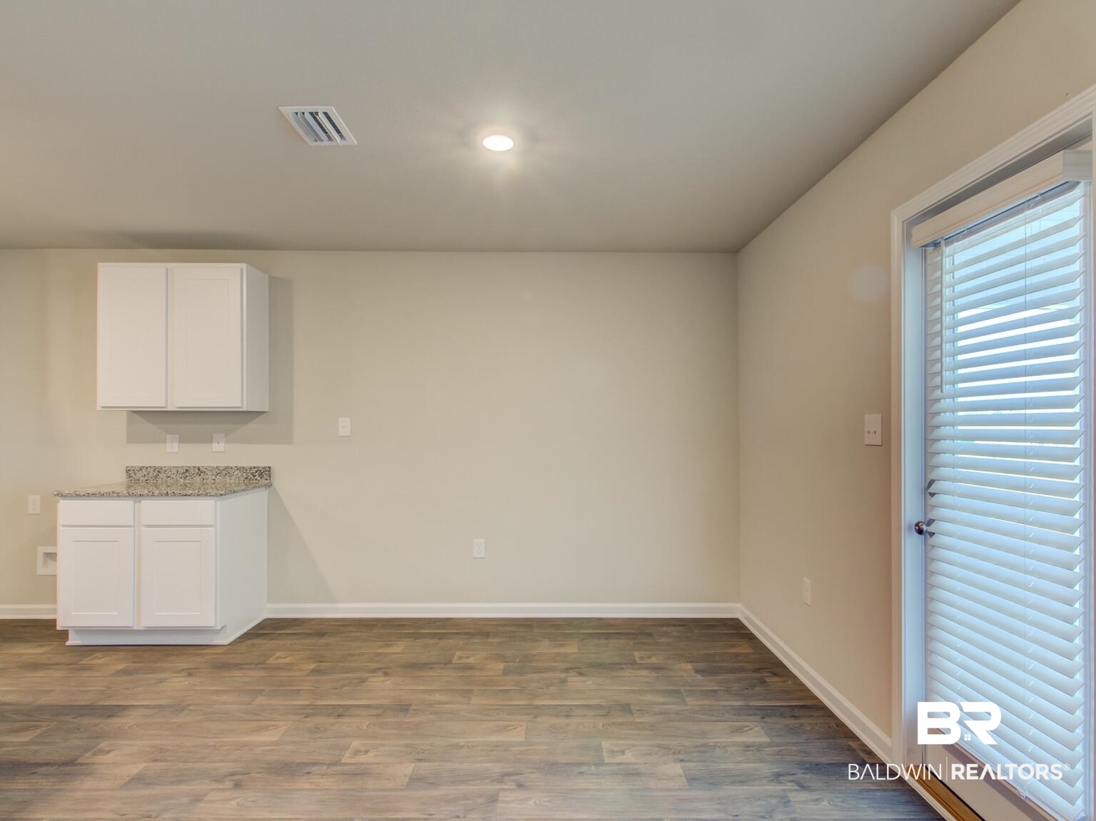 23952 Citation Loop Daphne, AL 36526 - Photo 11 of 69 Unfurnished dining area with dark wood-style floors and baseboards