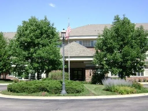 a view of a house with a tree beside it