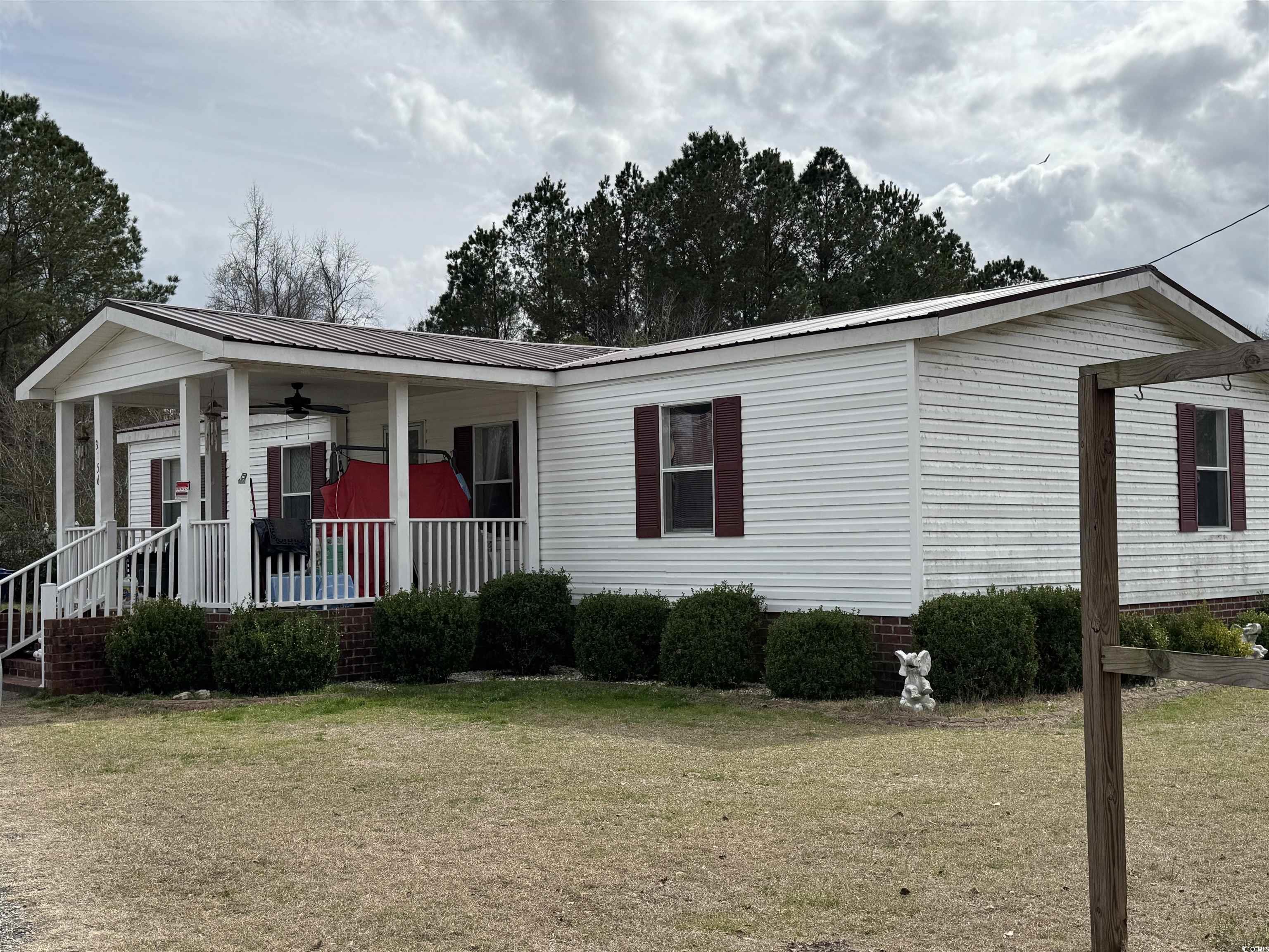 3156 Clearfield Road Galivants Ferry, SC 29544 - Photo 1 of 9 View of front of property with a porch, a front ya