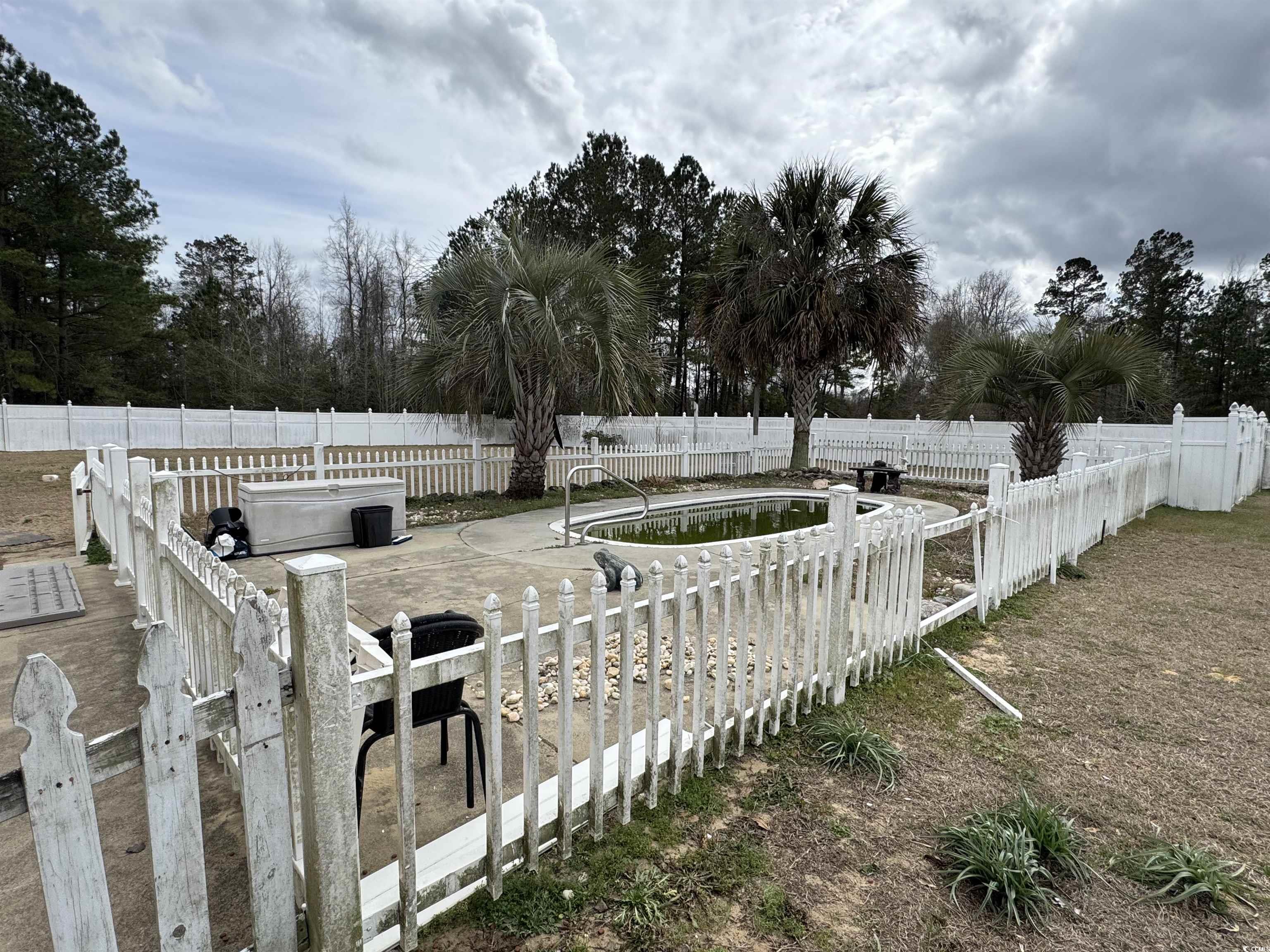 3156 Clearfield Road Galivants Ferry, SC 29544 - Photo 8 of 9 View of home's exterior with a gate and fence