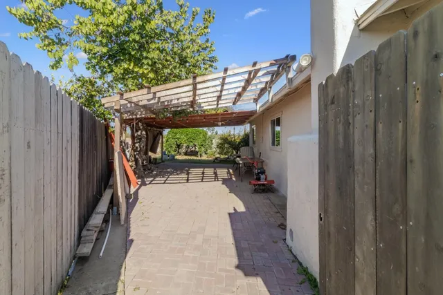 a patio with table and chairs