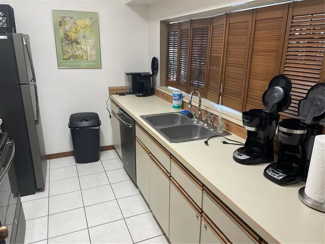 a kitchen with a sink and cabinets