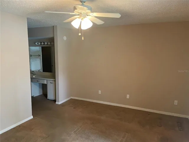 an empty room with a bathroom
