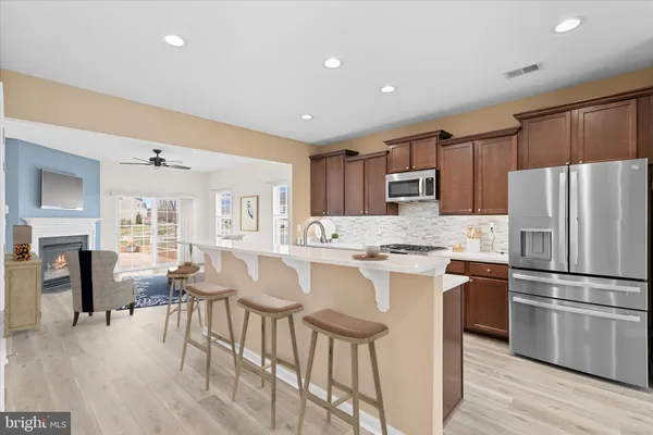 a kitchen with a sink stove and refrigerator