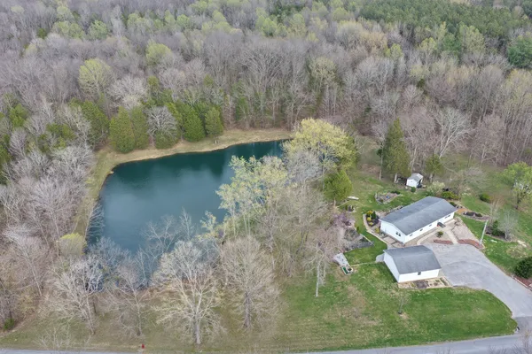 an aerial view of residential house with outdoor space
