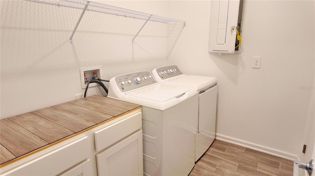 6366 Lakepine Street St. Cloud, FL 34771 - Photo 12 of 22 a utility room with dryer and washer