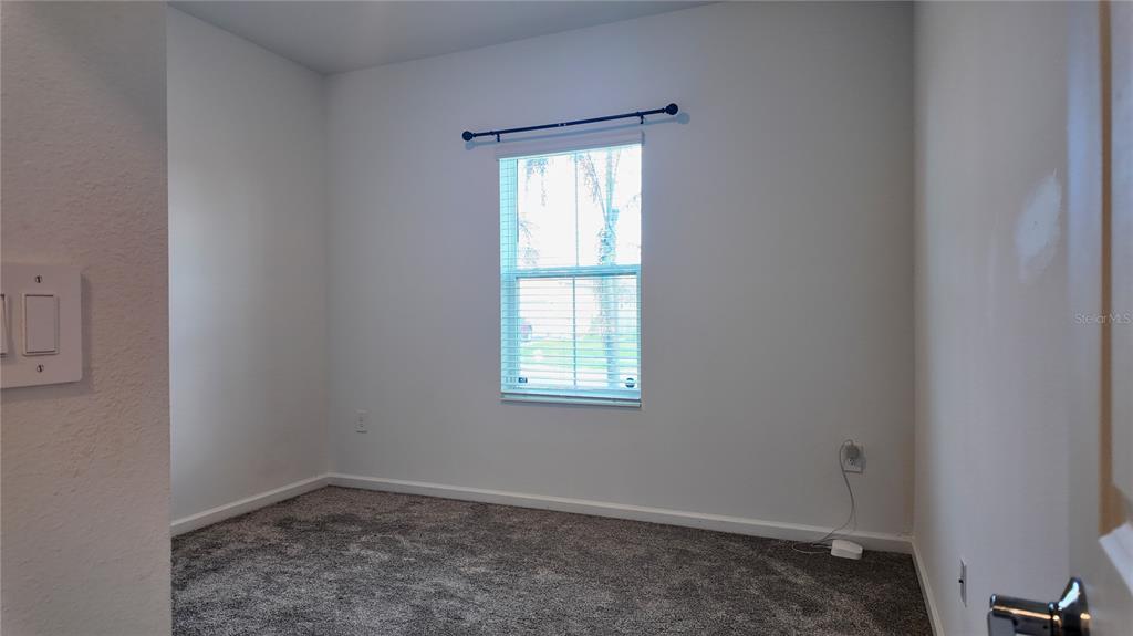 6366 Lakepine Street St. Cloud, FL 34771 - Photo 16 of 22 an empty room with a window