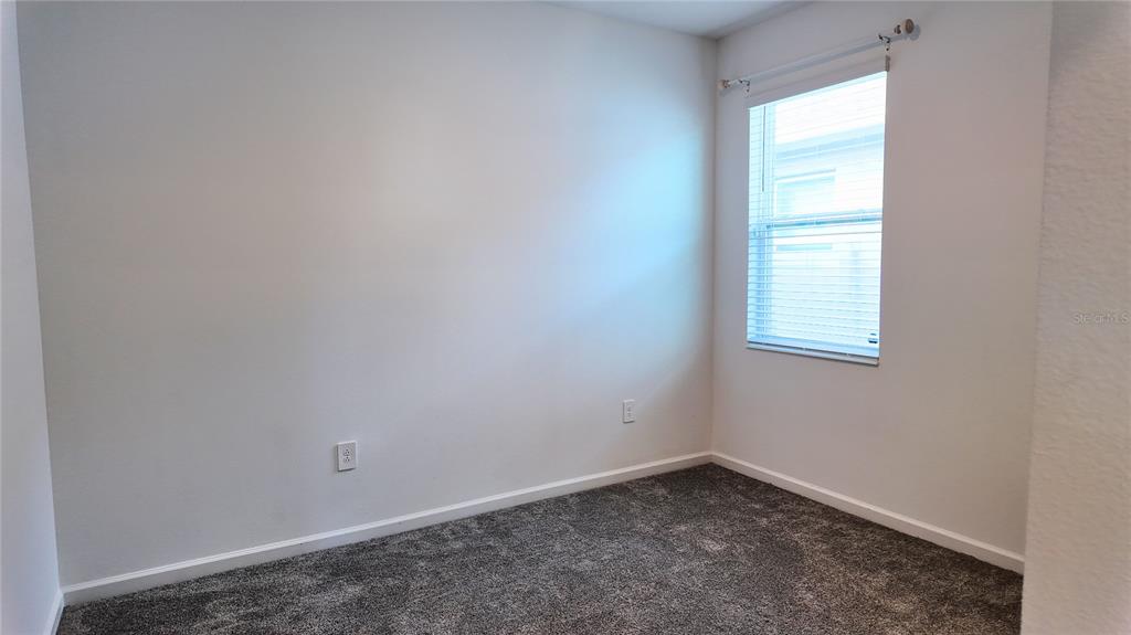 6366 Lakepine Street St. Cloud, FL 34771 - Photo 17 of 22 an empty room with a window