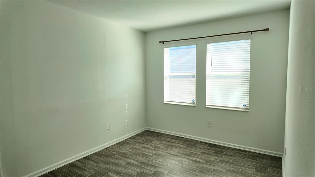 6366 Lakepine Street St. Cloud, FL 34771 - Photo 18 of 22 an empty room with a window