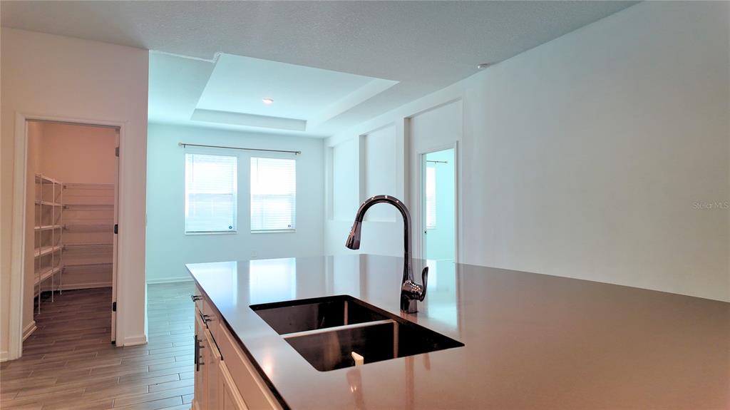 6366 Lakepine Street St. Cloud, FL 34771 - Photo 21 of 22 a kitchen with a sink and cabinets