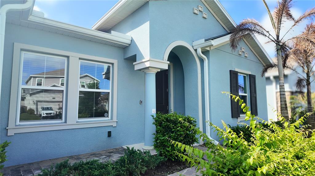 6366 Lakepine Street St. Cloud, FL 34771 - Photo 4 of 22 a view of a building with a potted plant windows