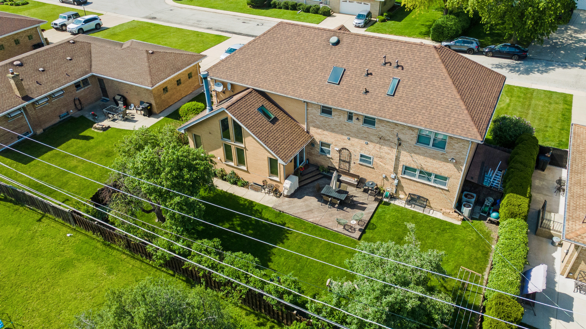 7911 West Rascher Avenue Chicago, IL 60656 - Photo 3 of 39 an aerial view of a house with a garden and trees